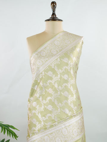Semi Silk In a lush green hue with fine gold zari jaal, this semi tissue saree from Varanasi shimmers with understated grandeur. The delicate weave and sheer finish create a light yet festive drape—perfect for elegant rituals and serene celebrations.br
#SemiTissueSaree #FineZariWeave #GreenAndGold #VaranasiElegance #HandloomHeritage #Manoranjitham #ManoranjithamStyle Nayana - Semi Silk Saree | Full Jaal Zari - Manoranjitham Weaves - Handloom Store