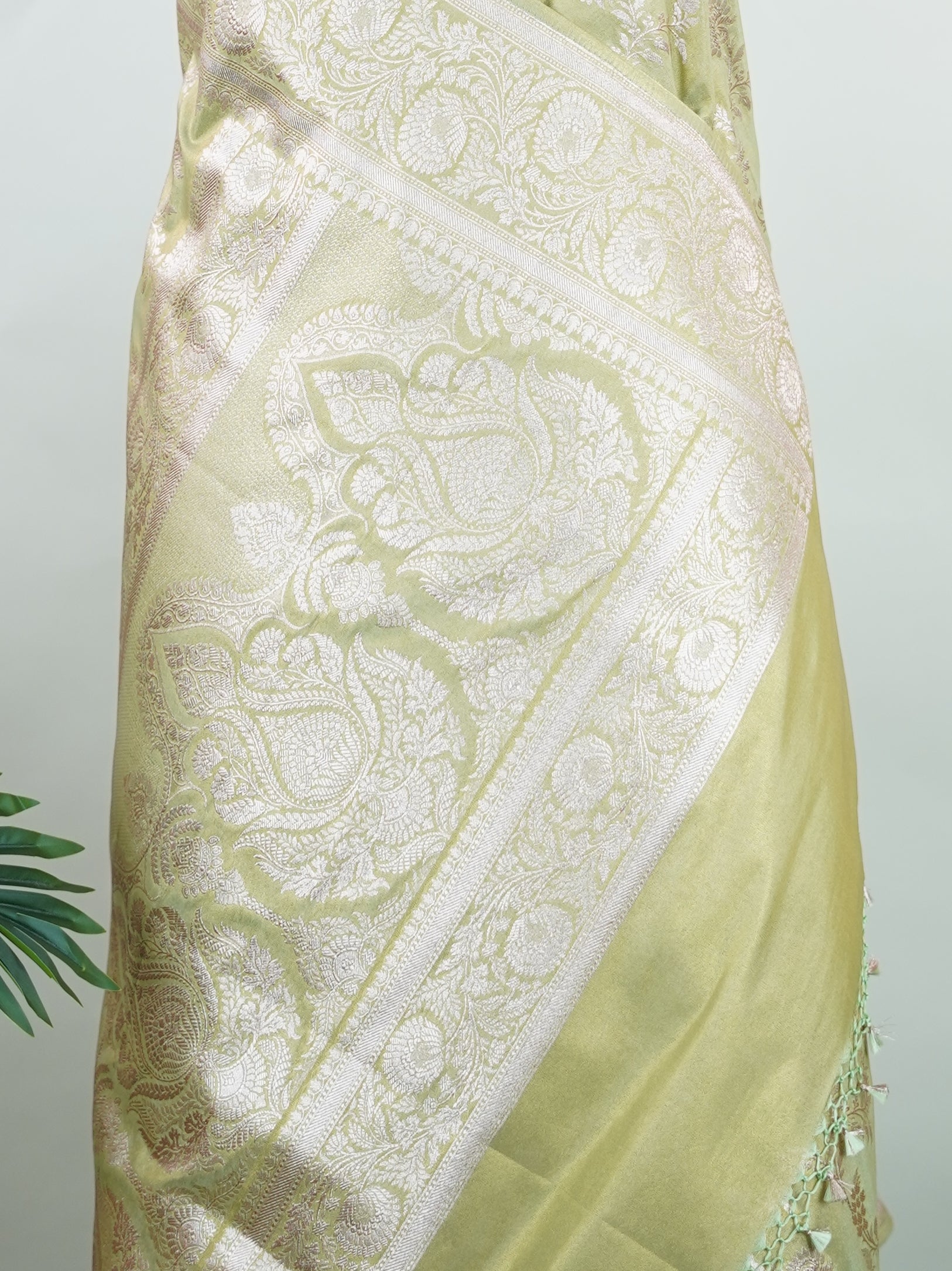 Semi Silk In a lush green hue with fine gold zari jaal, this semi tissue saree from Varanasi shimmers with understated grandeur. The delicate weave and sheer finish create a light yet festive drape—perfect for elegant rituals and serene celebrations.br
#SemiTissueSaree #FineZariWeave #GreenAndGold #VaranasiElegance #HandloomHeritage #Manoranjitham #ManoranjithamStyle Nayana - Semi Silk Saree | Full Jaal Zari - Manoranjitham Weaves - Handloom Store