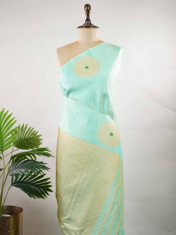 Gadwal Silk This elegant Gadwal saree is crafted from 100% pure silk in a soothing powder blue shade.br
The body features delicate zari buttis, complemented by big turning motifs on the pallu and stylish gap turning borders. Perfect for festive occasions and traditional celebrations, it exudes grace and timeless charm. Chakravakam - Powder Blue Handloom Gadwal Silk Saree | Pure Silk | Zari Border - Manoranjitham Weaves - Handloom Store