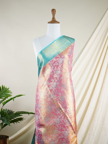 Kanchipuram Silk A delightful pink silk saree adorned with gold and silver zari buttas, paired with a striking cyan border. This saree celebrates the harmony of vibrant hues and intricate handloom artistry — perfect for weddings and timeless celebrations.             #ManoranjithamSilks #KanjivaramHandloom #PureSilkSaree #BridalElegance #TimelessTradition Atana - Pink Pure Kanjivaram Silk Saree | Zari Buttas - Manoranjitham Weaves - Handloom Store