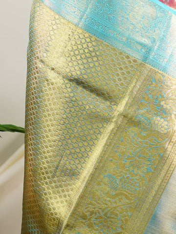 Kanchipuram Silk A delightful pink silk saree adorned with gold and silver zari buttas, paired with a striking cyan border. This saree celebrates the harmony of vibrant hues and intricate handloom artistry — perfect for weddings and timeless celebrations.             #ManoranjithamSilks #KanjivaramHandloom #PureSilkSaree #BridalElegance #TimelessTradition Atana - Pink Pure Kanjivaram Silk Saree | Zari Buttas - Manoranjitham Weaves - Handloom Store