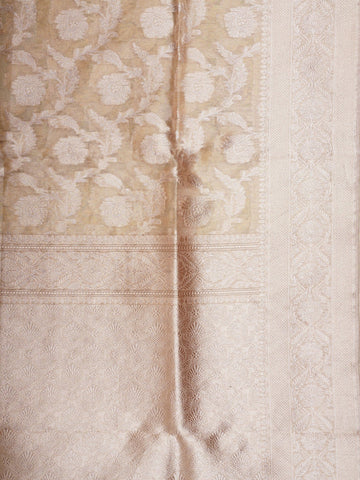 Katan A Tissue saree is the perfect blend of delicate silk and shimmering zari, woven to create an ethereal, translucent fabric that sparkles with every movement. Lightweight and luxurious, it’s ideal for grand occasions and celebrations where elegance is key. Draped in a Tissue saree, you embody timeless glamour with a modern twist. Avyaktha - Banarasi Tissue Kora Saree - Manoranjitham Weaves - Handloom Store