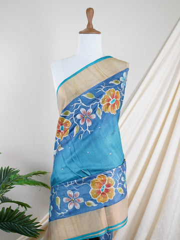 Tussars A Tussar saree with digital print and intricate Aari Peeta embroidery, combining modern design with delicate handcraft. Bageshree - Manoranjitham Weaves - Handloom Store