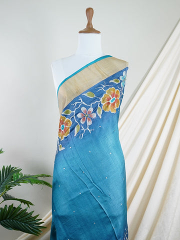 Tussars A Tussar saree with digital print and intricate Aari Peeta embroidery, combining modern design with delicate handcraft. Bageshree - Manoranjitham Weaves - Handloom Store