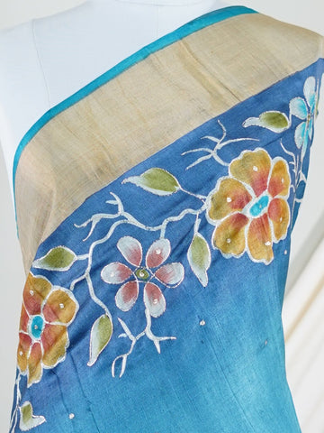 Tussars A Tussar saree with digital print and intricate Aari Peeta embroidery, combining modern design with delicate handcraft. Bageshree - Manoranjitham Weaves - Handloom Store