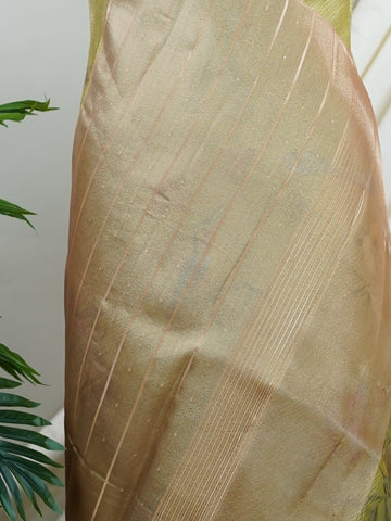 tissue This lightweight Semi Tissue saree from Varanasi blends the translucent beauty of tissue fabric with fine zari weave patterns that shimmer delicately across its surface. Its smooth drape and luminous finish make it a versatile choice for festive occasions, evening outings, and celebrations. A beautiful balance of traditional craftsmanship and contemporary wearability. Semi Tissue - Semi Silk Saree - Manoranjitham Weaves - Handloom Store