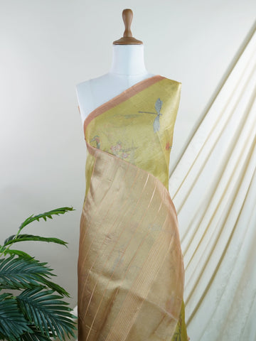 tissue This lightweight Semi Tissue saree from Varanasi blends the translucent beauty of tissue fabric with fine zari weave patterns that shimmer delicately across its surface. Its smooth drape and luminous finish make it a versatile choice for festive occasions, evening outings, and celebrations. A beautiful balance of traditional craftsmanship and contemporary wearability. Semi Tissue - Semi Silk Saree - Manoranjitham Weaves - Handloom Store