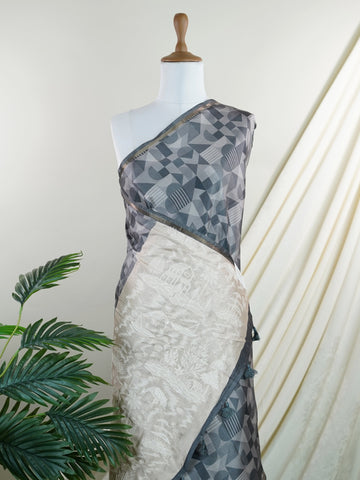 Katan This Semi Silk saree in soft cream blends delicate embroidery with digital print for a graceful finish. With no zari, its beauty lies in subtle textures and intricate detailing. Woven in Varanasi, it offers comfort with a refined aesthetic. A perfect pick for understated elegance. #SemiSilk #CreamElegance #EmbroideryDetails #VaranasiWeaves #ManoranjithamSarees Semi Tussar - Manoranjitham Weaves - Handloom Store