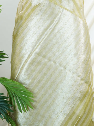 tissue Handwoven to perfection, this 100% Pure Silk  saree in Purple with Tan detailing is a tribute to India’s rich weaving traditions. Ideal for weddings and grand occasions. Bibhas - Purple Banarasi Tissue Kora Saree | Lightweight | Woven Buttas - Manoranjitham Weaves - Handloom Store