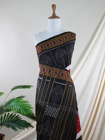 Handspun Cotton This 100% Pure Cotton silk saree, adorned in Black and detailed with nan weaving, reflects the grandeur of Orissa. The timeless Handwork motifs enhance its bridal charm. A perfect blend of luxury and tradition, it is designed for those who appreciate fine craftsmanship. Darbaria - Manoranjitham Weaves - Handloom Store