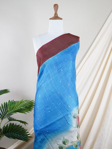 Tussars A Tussar saree with a plain upper body and digital print on the bottom border and pallu, enhanced with Aari Peeta embroidery for a subtle, handcrafted charm. Desha - Manoranjitham Weaves - Handloom Store