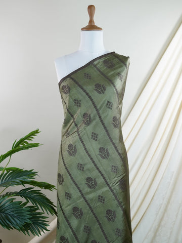 Chiniya Silk A masterpiece in Kota, this Brown saree adorned with Buttis patterns exudes regal charm. Perfect for the modern bride who cherishes tradition. Divya - Manoranjitham Weaves - Handloom Store