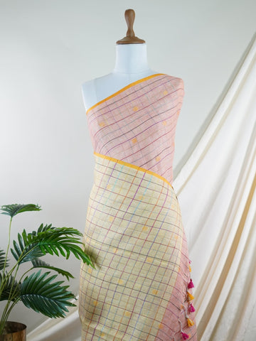 Linen A masterpiece from Gujarat, this Linen saree in Cream Peach is a tribute to India's rich handloom legacy. The nan weaving and Handwork motifs make it a perfect choice for brides and celebrations. Every thread speaks of elegance, tradition, and the skilled hands that bring this saree to life. Hemanta - Cream Handloom Cotton Saree | Zari Border | Traditional - Manoranjitham Weaves - Handloom Store