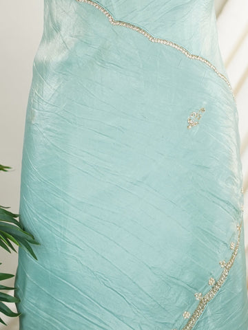 Organza Handwoven by skilled artisans of Karnataka, this 100% Pure Organza saree in Teal blends traditional elegance with intricate nan zari work. A truly stunning drape for special occasions. The interplay of colors and craftsmanship makes it a treasured piece for every saree connoisseur. Hindola - Teal Organza Saree - Manoranjitham Weaves - Handloom Store