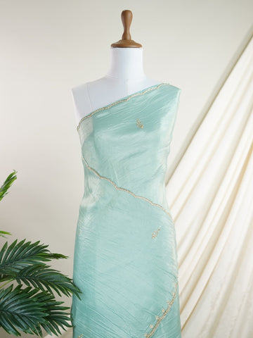 Organza Handwoven by skilled artisans of Karnataka, this 100% Pure Organza saree in Teal blends traditional elegance with intricate nan zari work. A truly stunning drape for special occasions. The interplay of colors and craftsmanship makes it a treasured piece for every saree connoisseur. Hindola - Teal Organza Saree - Manoranjitham Weaves - Handloom Store