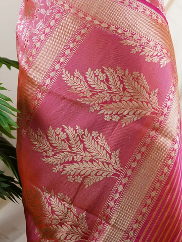 Katan This captivating saree, Hitaprada, is crafted from 100% pure Katan silk, known for its exquisite richness and texture. Featuring intricate silk Zari motifs, it showcases a stunning interplay of colours that symbolize universal welfare and compassion. Perfect for festive occasions, this handloom piece reflects the artistry of Indian weavers. Celebrate your elegance with this timeless saree that embodies love and kindness. Hitaprada - Banarasi Katan Silk Saree | Pure Zari - Manoranjitham Weaves - Handlo