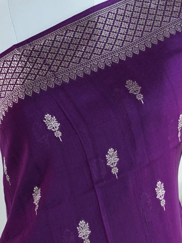Georgette This Tussar Georgette saree from Varanasi brings together the textured richness of tussar silk with the fluid grace of georgette. Woven on a powerloom, it drapes light and airy, perfect for effortless elegance. Ideal for both day events and evening gatherings, it reflects quiet sophistication with a modern twist on tradition. Indumathi - Georgette Saree | Handwoven | Varanasi - Manoranjitham Weaves - Handloom Store