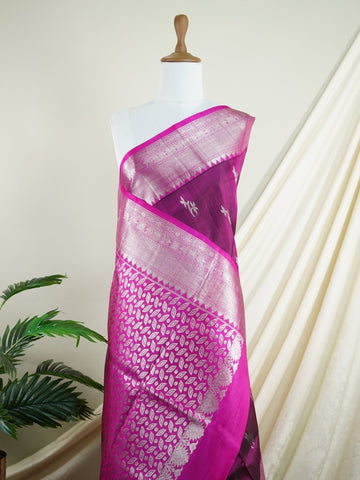 Venkatagiri Silk This 100% Pure Silk  silk saree, adorned in Maroon Pink and detailed with Pure Zari weaving, reflects the grandeur of Venkatagiri. The timeless Buttis motifs enhance its bridal charm. A perfect blend of luxury and tradition, it is designed for those who appreciate fine craftsmanship. Jaunpuri - Manoranjitham Weaves - Handloom Store