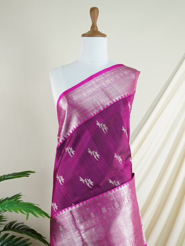 Venkatagiri Silk This 100% Pure Silk  silk saree, adorned in Maroon Pink and detailed with Pure Zari weaving, reflects the grandeur of Venkatagiri. The timeless Buttis motifs enhance its bridal charm. A perfect blend of luxury and tradition, it is designed for those who appreciate fine craftsmanship. Jaunpuri - Manoranjitham Weaves - Handloom Store