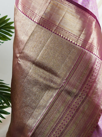 Kanchipuram Silk A masterpiece from Maharashtra, this 100% Pure Silk  saree in Baby Pink is a tribute to India's rich handloom legacy. The Pure Zari weaving and Buttis motifs make it a perfect choice for brides and celebrations. Every thread speaks of elegance, tradition, and the skilled hands that bring this saree to life. Jaunpuri - Pure Kanjivaram Silk Saree | Pure Zari - Manoranjitham Weaves - Handloom Store
