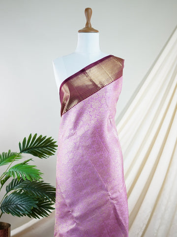 Kanchipuram Silk A masterpiece from Maharashtra, this 100% Pure Silk  saree in Baby Pink is a tribute to India's rich handloom legacy. The Pure Zari weaving and Buttis motifs make it a perfect choice for brides and celebrations. Every thread speaks of elegance, tradition, and the skilled hands that bring this saree to life. Jaunpuri - Pure Kanjivaram Silk Saree | Pure Zari - Manoranjitham Weaves - Handloom Store