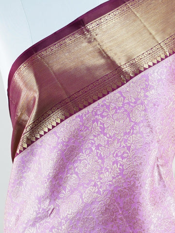Kanchipuram Silk A masterpiece from Maharashtra, this 100% Pure Silk  saree in Baby Pink is a tribute to India's rich handloom legacy. The Pure Zari weaving and Buttis motifs make it a perfect choice for brides and celebrations. Every thread speaks of elegance, tradition, and the skilled hands that bring this saree to life. Jaunpuri - Pure Kanjivaram Silk Saree | Pure Zari - Manoranjitham Weaves - Handloom Store