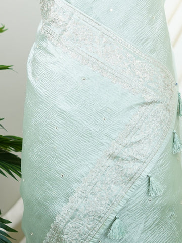 Tissue This semi-crush tissue saree from Varanasi radiates subtle elegance with its fine zari detailing and delicate embroidery. The fluid drape and medium weight lend it a graceful fall, ideal for refined gatherings and celebrations. A powerloom weave crafted with care, it offers timeless appeal in every pleat. Kiravani - Semi Silk Saree - Manoranjitham Weaves - Handloom Store