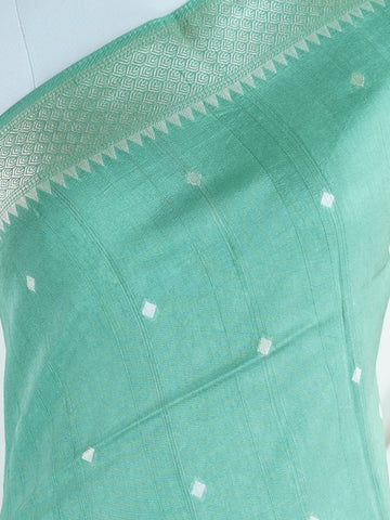 Georgette This Tussar Georgette saree from Varanasi brings together the textured richness of tussar silk with the fluid grace of georgette. Woven on a powerloom, it drapes light and airy, perfect for effortless elegance. Ideal for both day events and evening gatherings, it reflects quiet sophistication with a modern twist on tradition. Manjari - Georgette Saree | Handwoven | Varanasi - Manoranjitham Weaves - Handloom Store