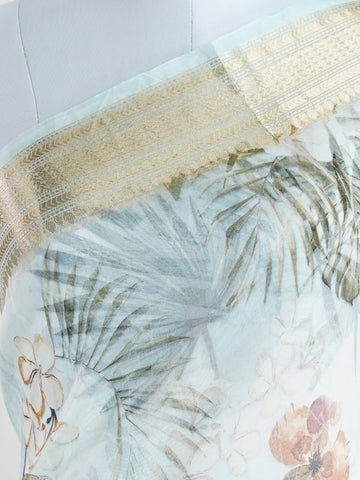 Organza Handwoven by skilled artisans of Karnataka, this 100% Pure Silk  saree in Powder Cyan blends traditional elegance with intricate nan zari work. A truly stunning drape for special occasions. The interplay of colors and craftsmanship makes it a treasured piece for every saree connoisseur. Marwa - Manoranjitham Weaves - Handloom Store