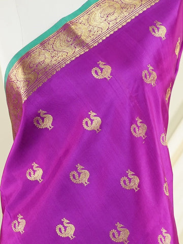 Venkatagiri Silk A masterpiece from Venkatagiri, this 100% Pure Silk  saree in Magenta is a tribute to India's rich handloom legacy. The Pure Zari weaving and Buttis motifs make it a perfect choice for brides and celebrations. Every thread speaks of elegance, tradition, and the skilled hands that bring this saree to life. Miyan Malhara     - Manoranjitham Weaves - Handloom Store