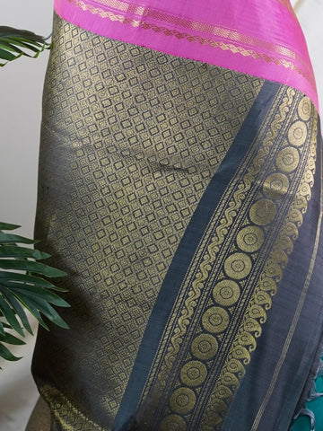 Gadwal Silk This Gadwal silk saree, adorned in Cyan and detailed with Pure Zari weaving, reflects the grandeur of Gadwal. The timeless Buttis motifs enhance its bridal charm. A perfect blend of luxury and tradition, it is designed for those who appreciate fine craftsmanship. Nattakurinji - Manoranjitham Weaves - Handloom Store