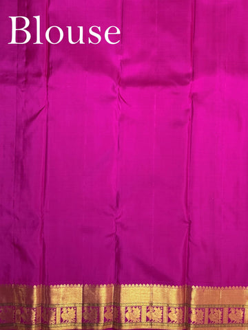 Kanchipuram Silk A masterpiece from Kanchipuram, this Kanjivaram saree in Lime Tree Green is a tribute to India's rich handloom legacy. The Pure Zari weaving and Buttis motifs make it a perfect choice for brides and celebrations. Every thread speaks of elegance, tradition, and the skilled hands that bring this saree to life. Nattakurinji - Manoranjitham Weaves - Handloom Store
