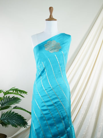 Katan A beautiful deep blue handloom saree enriched with pure gold zari buttis. Inspired by the serenity of the Ganges, its craftsmanship and sheen make it a luxurious drape. Neelashria - Manoranjitham Weaves - Handloom Store