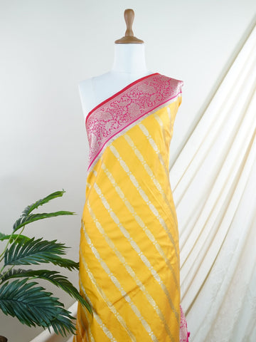 Katan Bright and joyful, this Katan semi silk saree from Varanasi features vivid yellow softened by pink stripes that lend it a playful rhythm. The silk's gentle sheen pairs with the structured weave to create a look that's both traditional and refreshingly modern.br
#KatanSemiSilk #StripedSaree #YellowAndPink #VaranasiWeaves #HandloomCharm #Manoranjitham #ManoranjithamStyle Neelima - Semi Silk Saree | Nan Zari Work | Handwoven - Manoranjitham Weaves - Handloom Store