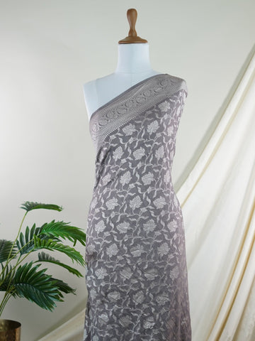 Katan Woven in the heart of Varanasi, this georgette saree features an intricate all-over jaal that glistens across its fluid, lightweight fabric. Elegant and ethereal, it brings together tradition and ease—ideal for evening celebrations and graceful occasions.br
#GeorgetteSaree #JaalWork #VaranasiWeaves #EtherealElegance #HandloomGrace #Manoranjitham #ManoranjithamStyle Nirmala - Georgette Saree | Full Jaal Zari - Manoranjitham Weaves - Handloom Store