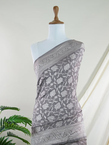 Katan Woven in the heart of Varanasi, this georgette saree features an intricate all-over jaal that glistens across its fluid, lightweight fabric. Elegant and ethereal, it brings together tradition and ease—ideal for evening celebrations and graceful occasions.br
#GeorgetteSaree #JaalWork #VaranasiWeaves #EtherealElegance #HandloomGrace #Manoranjitham #ManoranjithamStyle Nirmala - Georgette Saree | Full Jaal Zari - Manoranjitham Weaves - Handloom Store