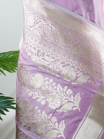 Katan An exquisite creation from Varanasi, this glass tissue saree is adorned with delicate embroidery and refined ari pita work. Its sheer texture catches the light with every fold, while the intricate detailing adds depth and artistry. A luminous drape for occasions steeped in grace and tradition. Padmini - Manoranjitham Weaves - Handloom Store