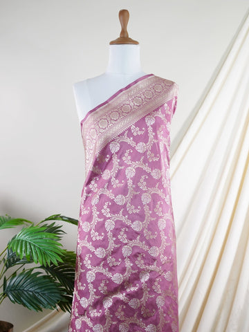Katan Ponnarajula embodies the golden hues of blooms, a full jaal Katan silk saree that gracefully envelops you in elegance. This exquisite piece showcases a stunning interplay of colors skillfully woven into the fabric, creating a radiant visual impact. Adorned with intricate pure zari detailing and refined handwork, it is ideal for festive occasions and special celebrations. Embrace the rich heritage of Varanasi craftsmanship with Ponnarajula, a timeless symbol of beauty. Ponnarajula - Banarasi Katan Silk