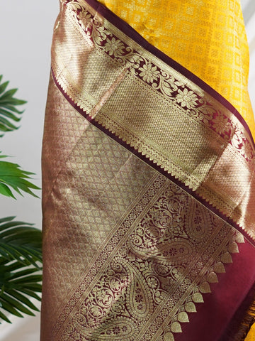 Kanchipuram Silk A masterpiece from Kanchipuram, this Kanjivaram saree in Yellow is a tribute to India's rich handloom legacy. The Pure Zari weaving and Buttis motifs make it a perfect choice for brides and celebrations. Every thread speaks of elegance, tradition, and the skilled hands that bring this saree to life. Priya - Yellow Pure Kanjivaram Silk Saree | Pure Zari - Manoranjitham Weaves - Handloom Store