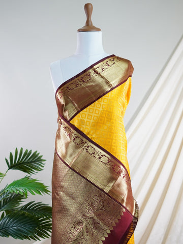 Kanchipuram Silk A masterpiece from Kanchipuram, this Kanjivaram saree in Yellow is a tribute to India's rich handloom legacy. The Pure Zari weaving and Buttis motifs make it a perfect choice for brides and celebrations. Every thread speaks of elegance, tradition, and the skilled hands that bring this saree to life. Priya - Yellow Pure Kanjivaram Silk Saree | Pure Zari - Manoranjitham Weaves - Handloom Store