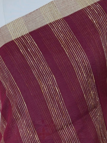 Handspun Cotton A masterpiece from Gujarat, this Handpsun Cotton saree in Maroon is a tribute to India's rich handloom legacy. The nan weaving and Handwork motifs make it a perfect choice for brides and celebrations. Every thread speaks of elegance, tradition, and the skilled hands that bring this saree to life. Rageshree - Maroon Handloom Cotton Saree | Zari Border | Traditional - Manoranjitham Weaves - Handloom Store