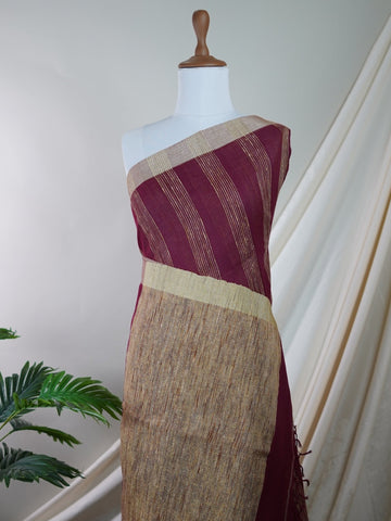 Handspun Cotton A masterpiece from Gujarat, this Handpsun Cotton saree in Maroon is a tribute to India's rich handloom legacy. The nan weaving and Handwork motifs make it a perfect choice for brides and celebrations. Every thread speaks of elegance, tradition, and the skilled hands that bring this saree to life. Rageshree - Maroon Handloom Cotton Saree | Zari Border | Traditional - Manoranjitham Weaves - Handloom Store