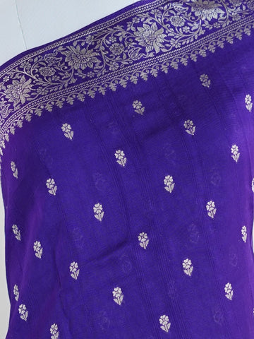 Georgette This Tussar Georgette saree from Varanasi brings together the textured richness of tussar silk with the fluid grace of georgette. Woven on a powerloom, it drapes light and airy, perfect for effortless elegance. Ideal for both day events and evening gatherings, it reflects quiet sophistication with a modern twist on tradition. Rathi - Georgette Saree | Handwoven | Varanasi - Manoranjitham Weaves - Handloom Store