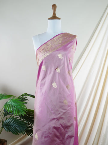 Katan Rathi, named after the vibrant rathi flower, is a full jaal Katan silk saree that showcases a brilliant blend of colors, enhancing your charm. This beautiful piece features intricate patterns woven into the fabric, evoking the essence of blooming flora. Adorned with pure zari detailing and exquisite handwork, it is perfect for celebrations and cultural events. Embrace the tradition of Varanasi weaving with Rathi, a timeless masterpiece of elegance. Rathi  - Manoranjitham Weaves - Handloom Store