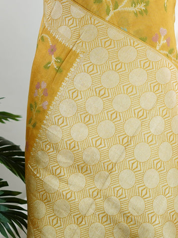 Georgette This Tussar Georgette saree from Varanasi brings together the textured richness of tussar silk with the fluid grace of georgette. Woven on a powerloom, it drapes light and airy, perfect for effortless elegance. Ideal for both day events and evening gatherings, it reflects quiet sophistication with a modern twist on tradition. Rohini - Georgette Saree | Handwoven | Varanasi - Manoranjitham Weaves - Handloom Store