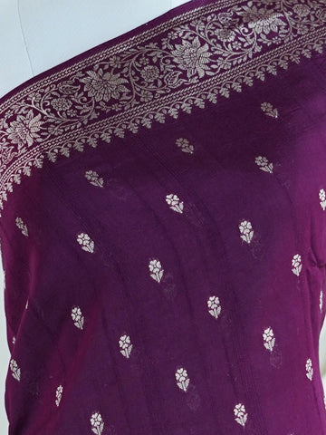 Georgette This Tussar Georgette saree from Varanasi brings together the textured richness of tussar silk with the fluid grace of georgette. Woven on a powerloom, it drapes light and airy, perfect for effortless elegance. Ideal for both day events and evening gatherings, it reflects quiet sophistication with a modern twist on tradition. Suhasini - Georgette Saree | Handwoven | Varanasi - Manoranjitham Weaves - Handloom Store