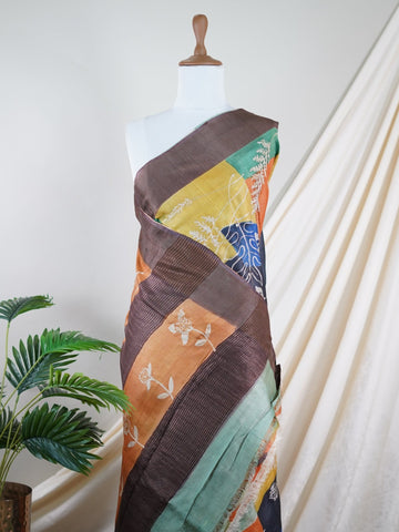 Tussars A Tussar saree with digital print and intricate Aari Peeta work, combining contemporary style with delicate handcraft. Tilak Kamoda     - Manoranjitham Weaves - Handloom Store