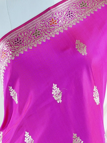 Katan An exquisite creation from Varanasi, this glass tissue saree is adorned with delicate embroidery and refined ari pita work. Its sheer texture catches the light with every fold, while the intricate detailing adds depth and artistry. A luminous drape for occasions steeped in grace and tradition. Tilottama - Manoranjitham Weaves - Handloom Store