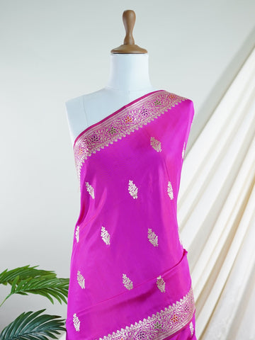 Katan An exquisite creation from Varanasi, this glass tissue saree is adorned with delicate embroidery and refined ari pita work. Its sheer texture catches the light with every fold, while the intricate detailing adds depth and artistry. A luminous drape for occasions steeped in grace and tradition. Tilottama - Manoranjitham Weaves - Handloom Store