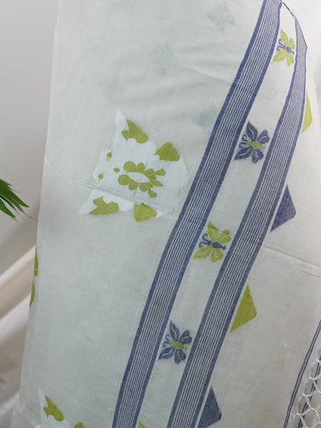 Cotton Woven with care in the looms of West Bengal, this 100% pure cotton saree blends everyday comfort with understated elegance. Fine zari floral designs shimmer softly against the breathable fabric, while the small border adds a touch of refinement. Lightweight and timeless, it’s perfect for summer gatherings and quiet celebrations Vathapi - Handloom Cotton Saree - Manoranjitham Weaves - Handloom Store